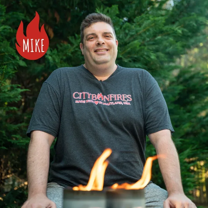 Mike, co-founder of City Bonfires, with a lit City Bonfire in front of him